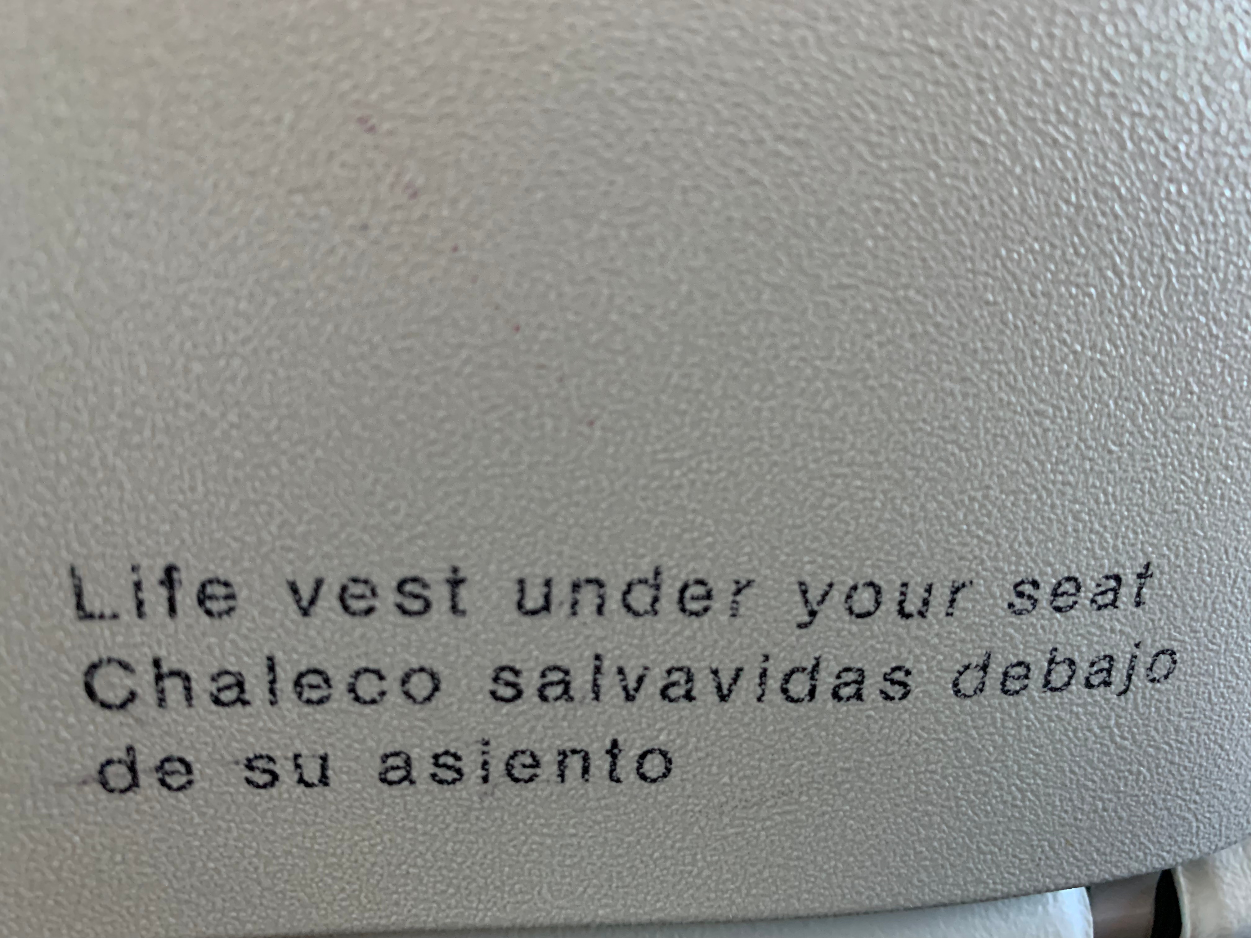 Photo back of the seat in front of you on the airplane